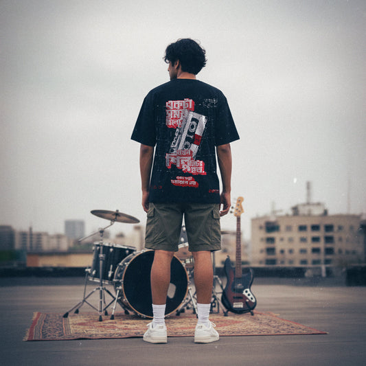 Person standing with musical instruments on a rooftop with a cityscape background